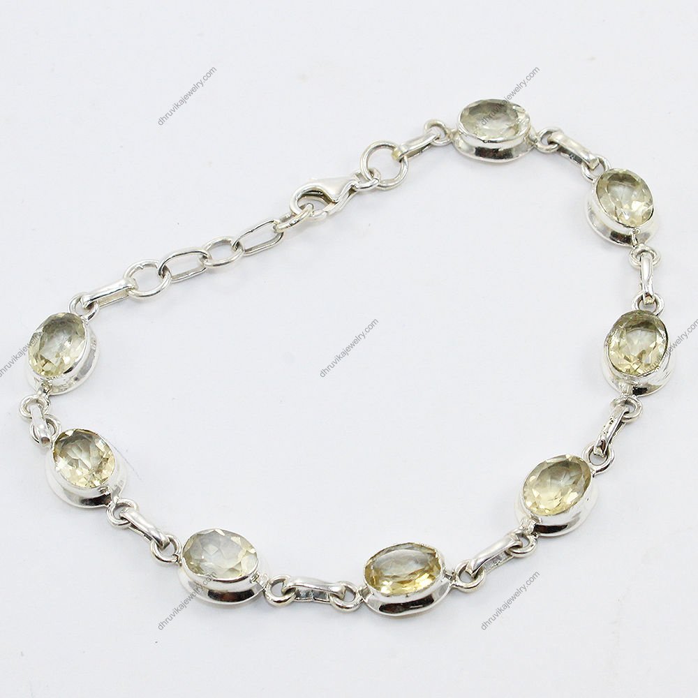 Sterling silver citrine bracelet with oval-cut gemstones, handcrafted and elegant for women.