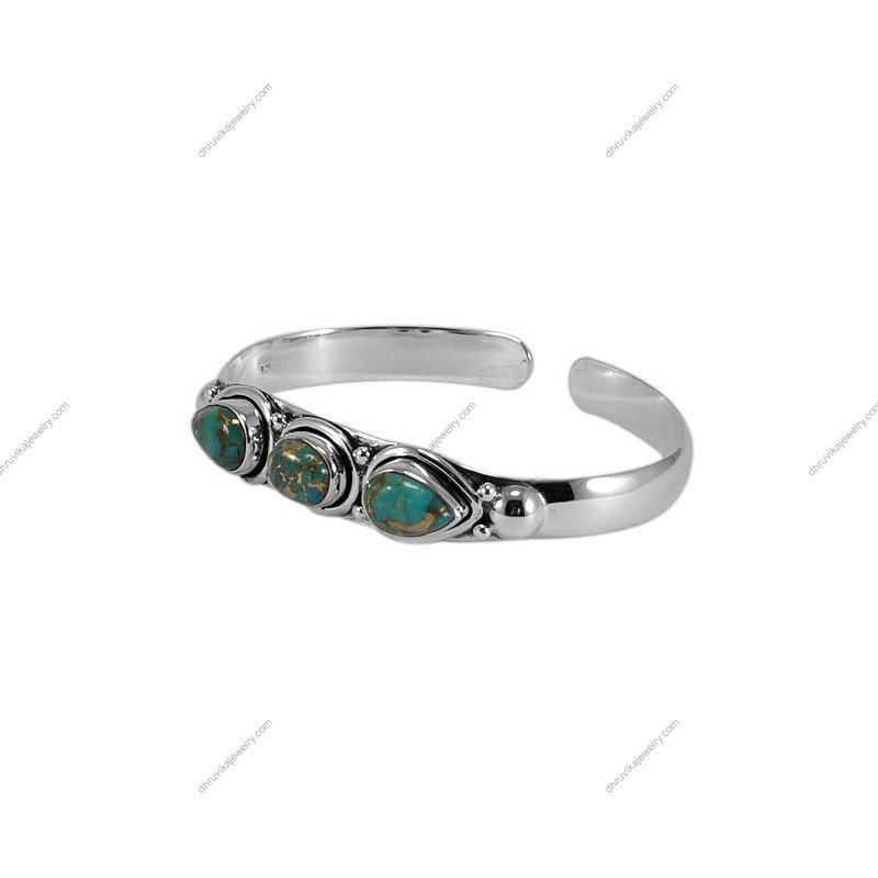 Handcrafted sterling silver turquoise cuff bracelet with natural gemstones and intricate detailing