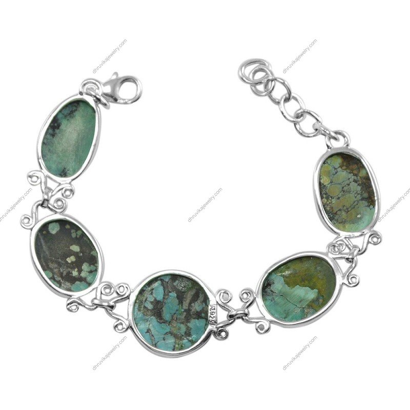 Handcrafted turquoise and sterling silver bracelet with natural gemstone stones in an elegant boho design.