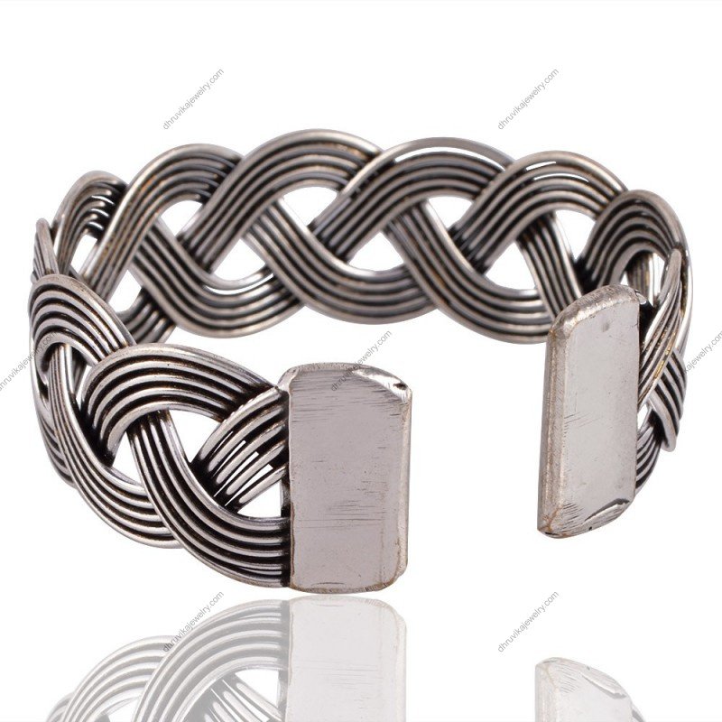 Handcrafted sterling silver woven cuff bracelet with intricate braided design