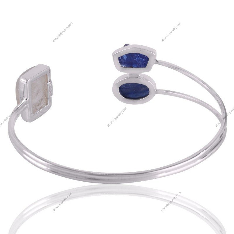 Handcrafted silver cuff bracelet with kyanite, tanzanite, and moonstone gemstones, adjustable fit, artisan design.