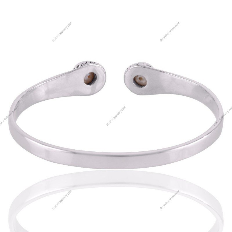 Sterling silver pearl cuff bracelet with intricate rope detailing and freshwater pearls