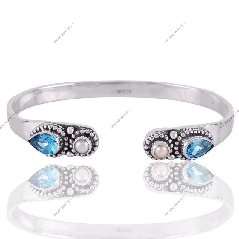 Sterling silver cuff bracelet with blue topaz and pearl gemstones, handcrafted boho jewelry