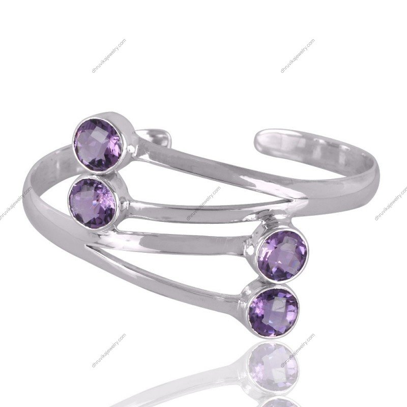Sterling silver amethyst cuff bracelet with four round-cut gemstones, handcrafted for timeless elegance.