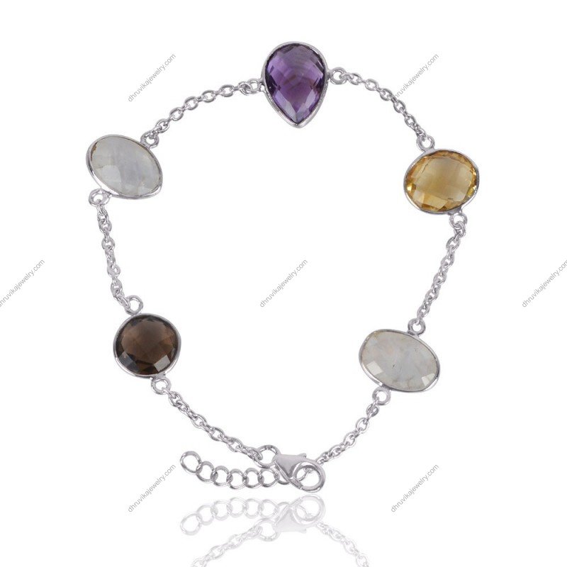 Sterling silver multi-gemstone bracelet featuring amethyst, citrine, moonstone, and smoky quartz in a delicate handcrafted design.