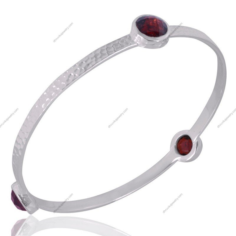 Handcrafted silver bangle with red gemstones and hammered texture_alternate_image