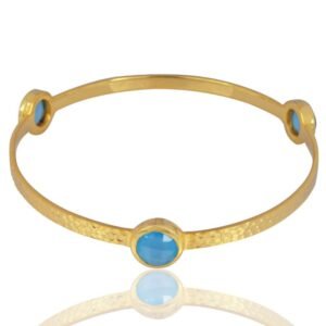 Gold-plated hammered bangle with blue chalcedony gemstones, handcrafted for an elegant look._main_view