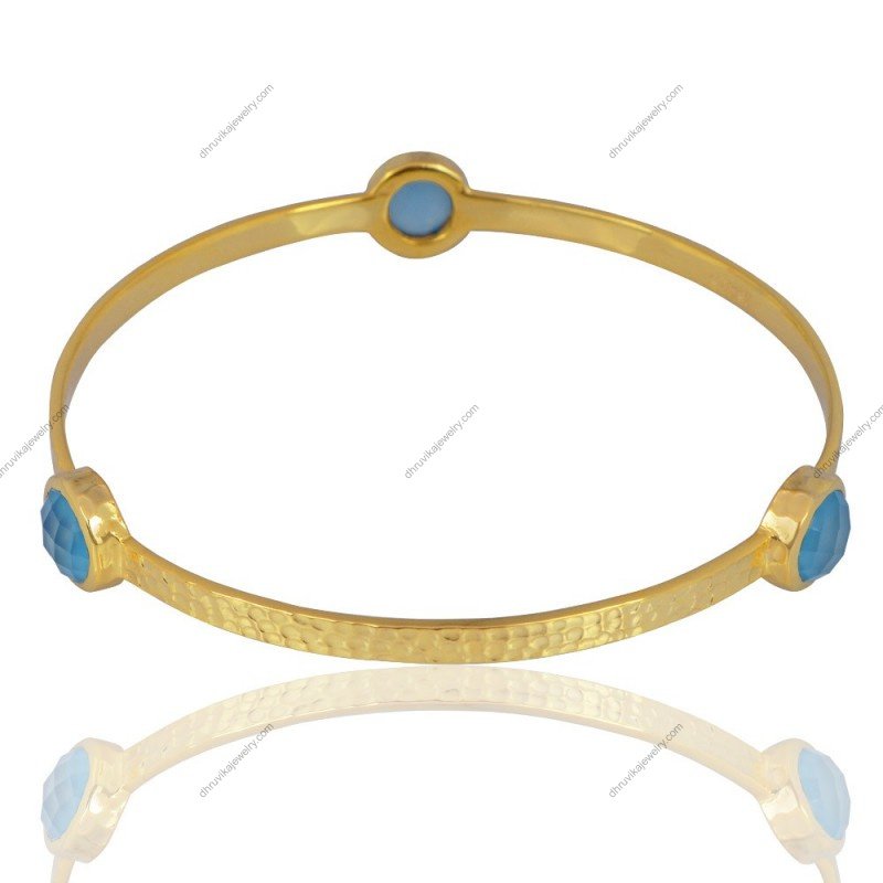 Gold-plated hammered bangle with blue chalcedony gemstones, handcrafted for an elegant look._alternate_image