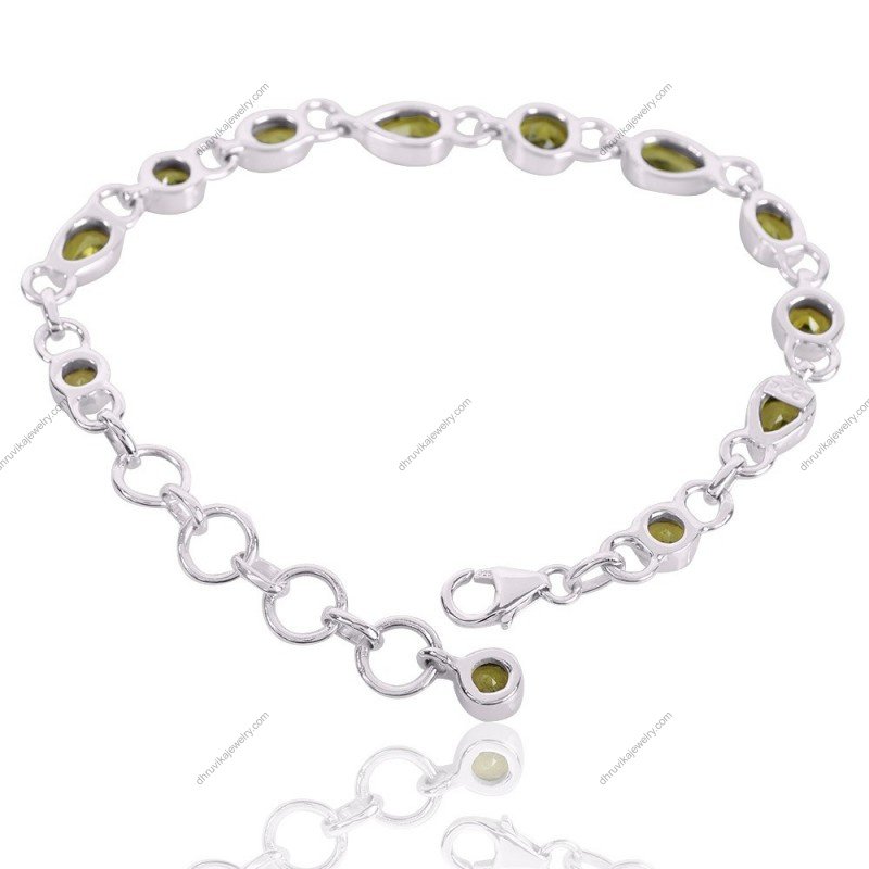 Sterling silver peridot bracelet with adjustable chain, featuring round and pear-shaped gemstones view1