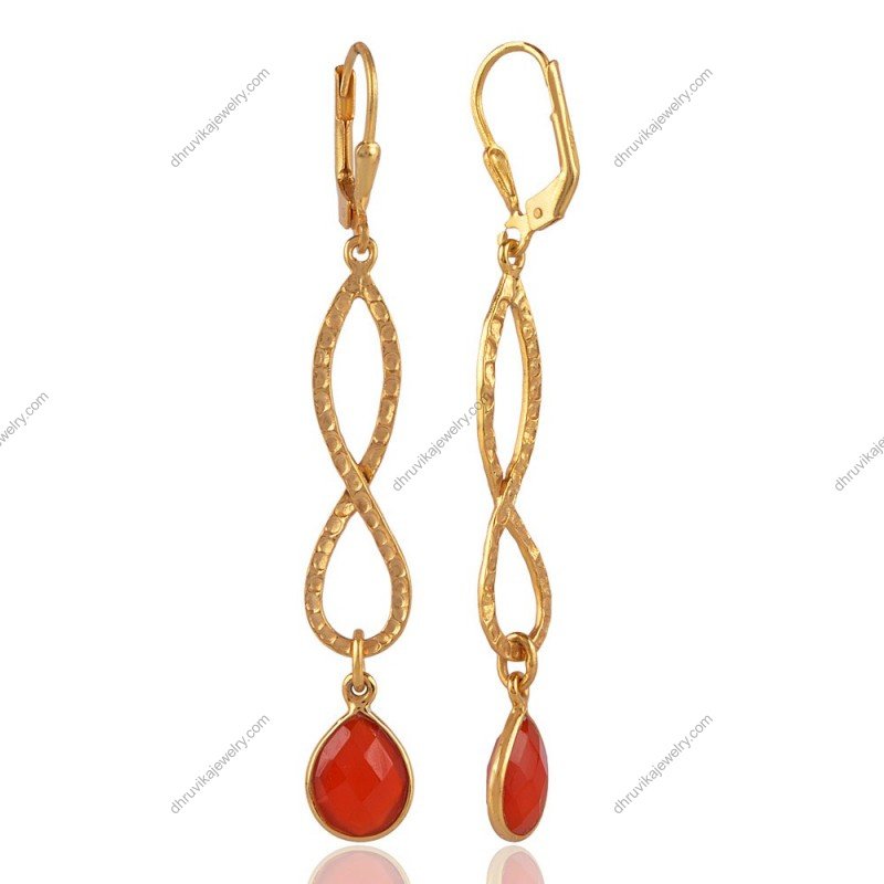 Gold infinity drop earrings with red gemstone, elegant and timeless jewelry piece. view1
