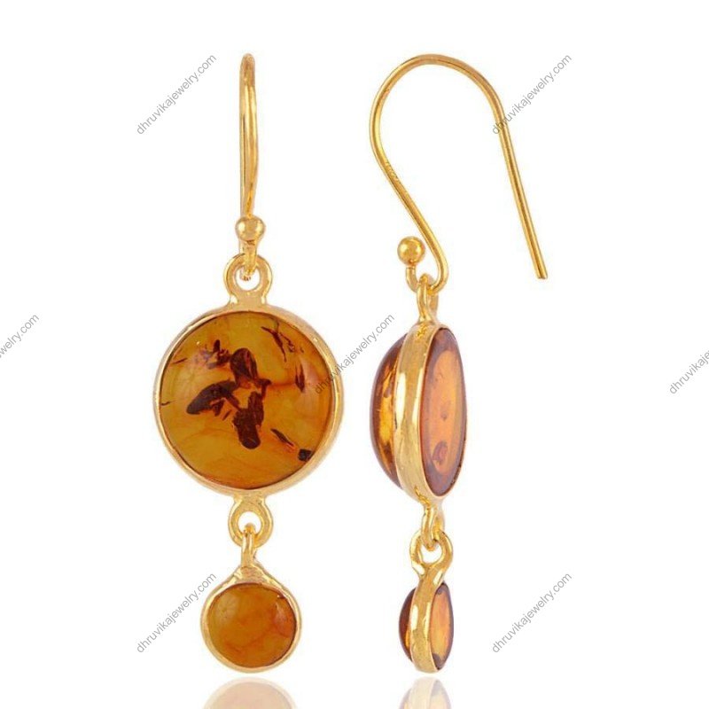 Amber dangle earrings in gold-plated sterling silver with round Baltic amber stones view1