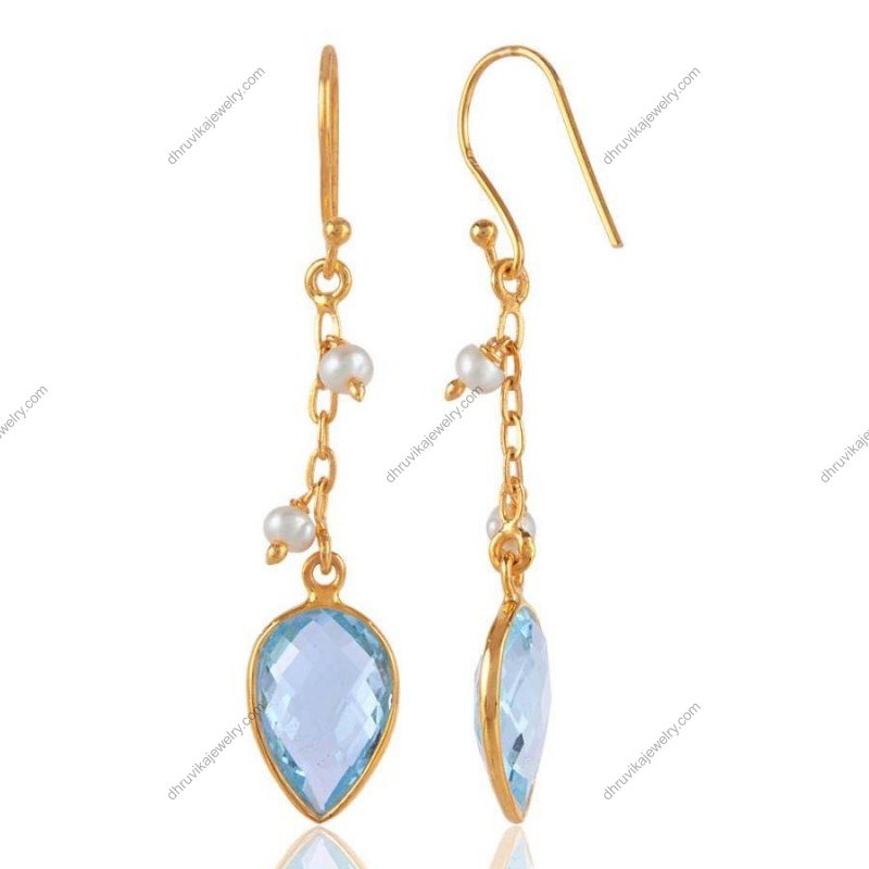 Gold-plated silver earrings with blue topaz teardrop gemstones and pearl accents view1