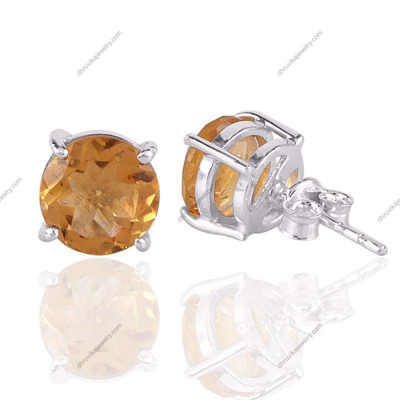 Sterling silver citrine stud earrings with round-cut yellow gemstone in prong setting view1