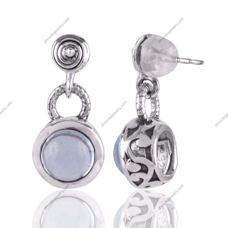 Sterling silver blue topaz dangle earrings featuring round gemstone in polished metal setting view1