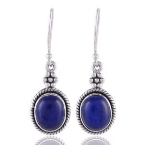 Sterling silver lapis lazuli dangle earrings with intricate detailing and deep blue gemstone main view