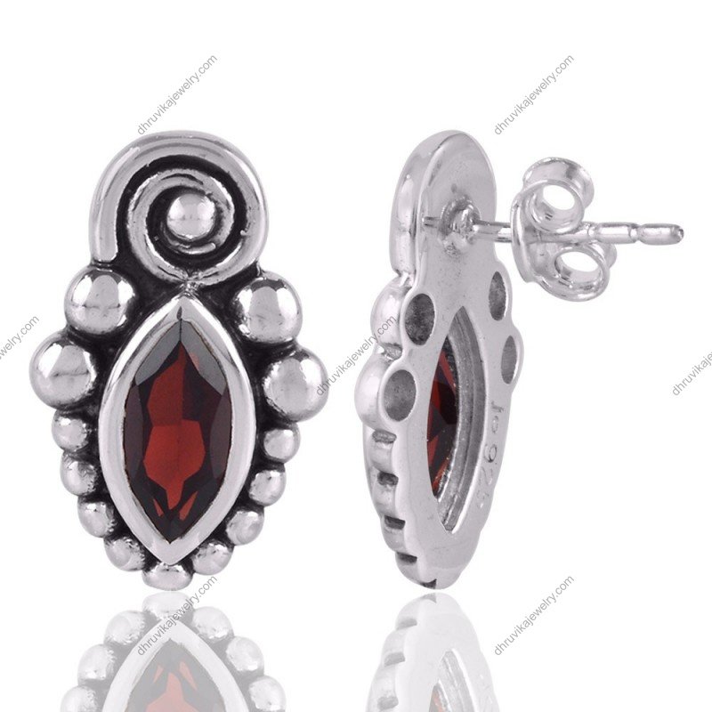 Sterling silver garnet stud earrings with vintage design and marquise-cut gemstones view1