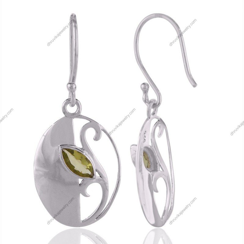 Sterling silver earrings with peridot gemstone, intricate swirl design, handcrafted elegance. view1