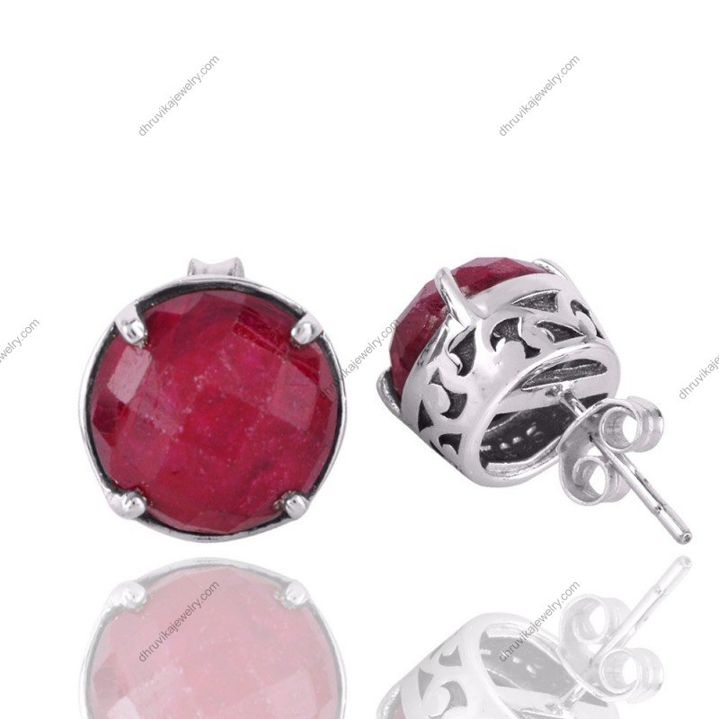 Sterling silver ruby stud earrings with faceted stones in a classic prong setting view1