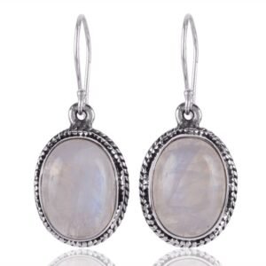 Handcrafted silver moonstone dangle earrings with sterling silver detailing and an iridescent glow main view