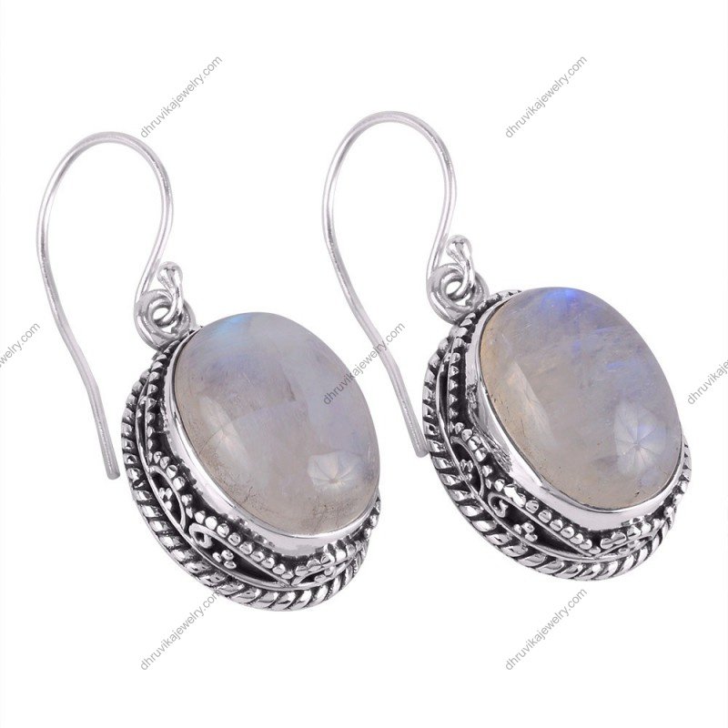 Handcrafted silver moonstone dangle earrings with sterling silver detailing and an iridescent glow alternate image