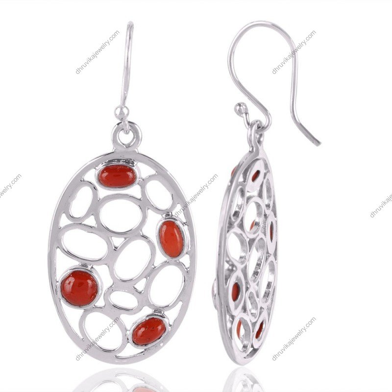Elegant silver coral dangle earrings with intricate silverwork and vibrant red coral gemstones view1