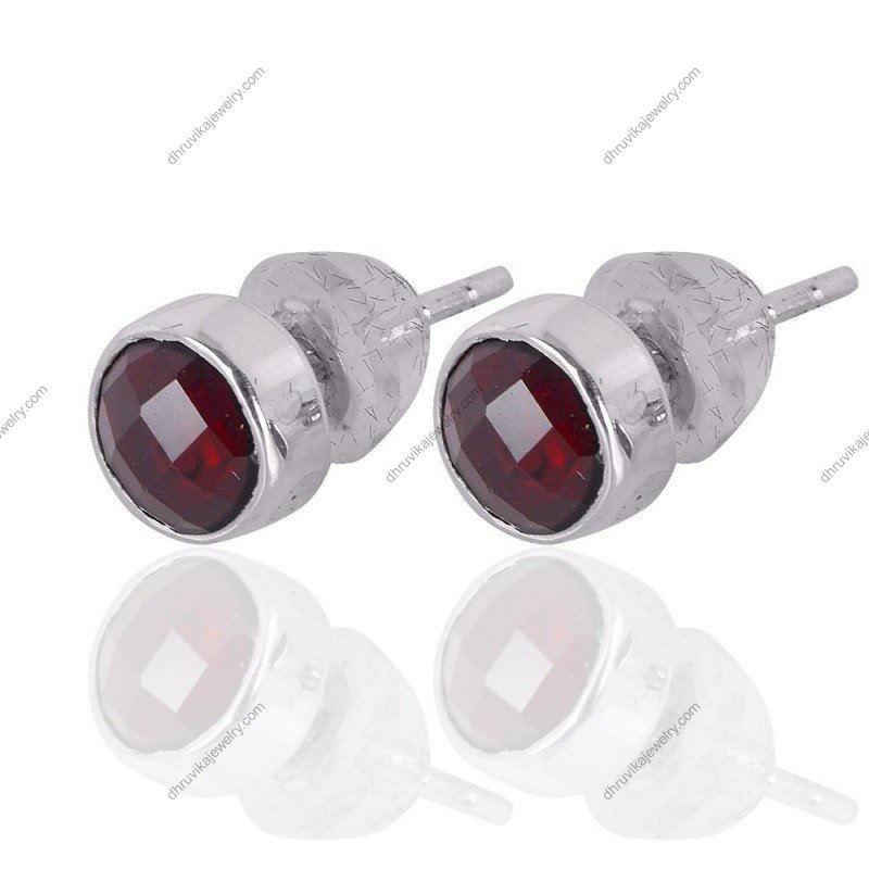 Silver garnet stud earrings with faceted red gemstones set in sterling silver view1