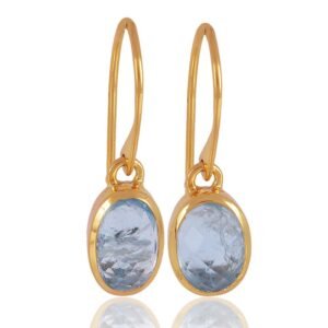 Gold-plated silver blue topaz dangle earrings with oval-cut gemstones and secure hook closure main view