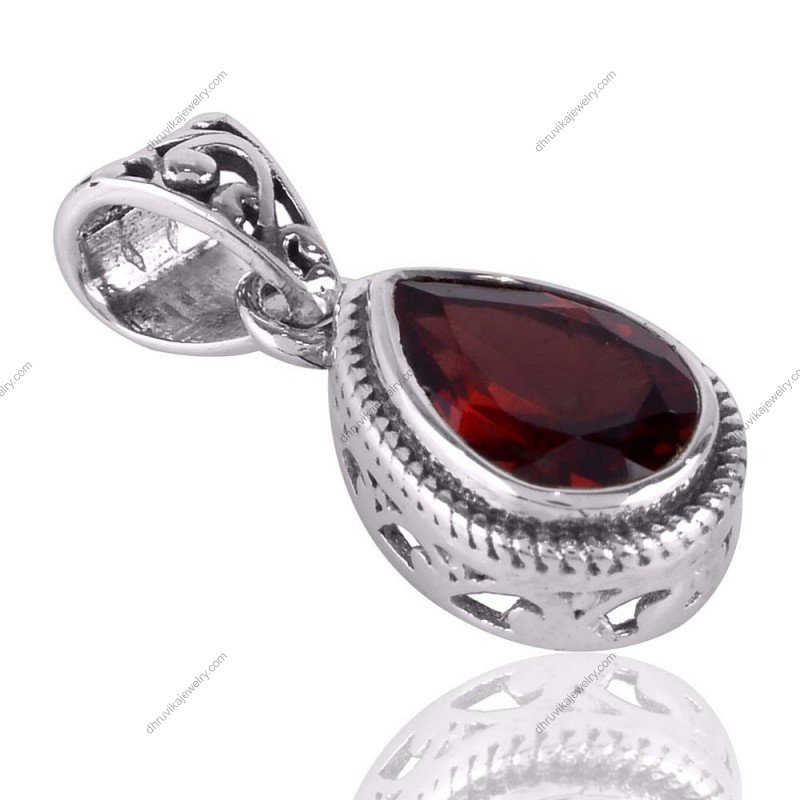 Sterling silver garnet teardrop pendant with vintage design and faceted red gemstone. alternate image