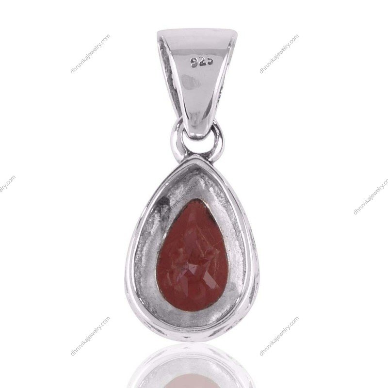Sterling silver garnet teardrop pendant with vintage design and faceted red gemstone. view1