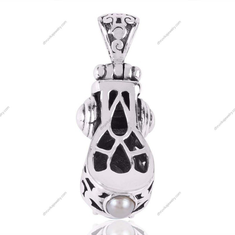 Sterling silver blue topaz filigree pendant with intricate vintage design view1