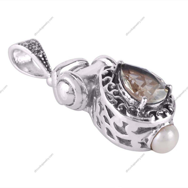 Sterling silver vintage teardrop pendant with faceted gemstone and intricate silver detailing alternate image