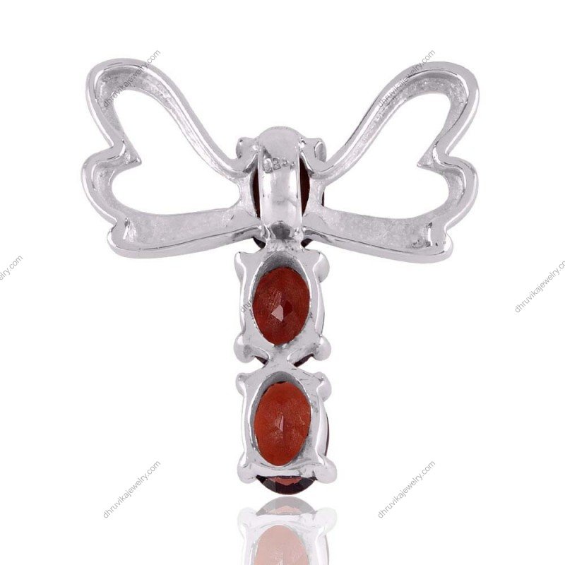 Sterling silver garnet dragonfly pendant with three oval-cut red garnet stones in an elegant silver setting. view1