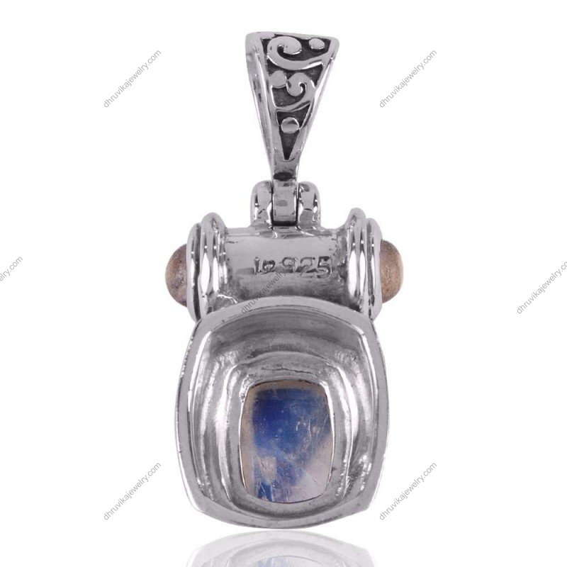Handcrafted sterling silver moonstone pendant with intricate detailing and celestial glow. view1