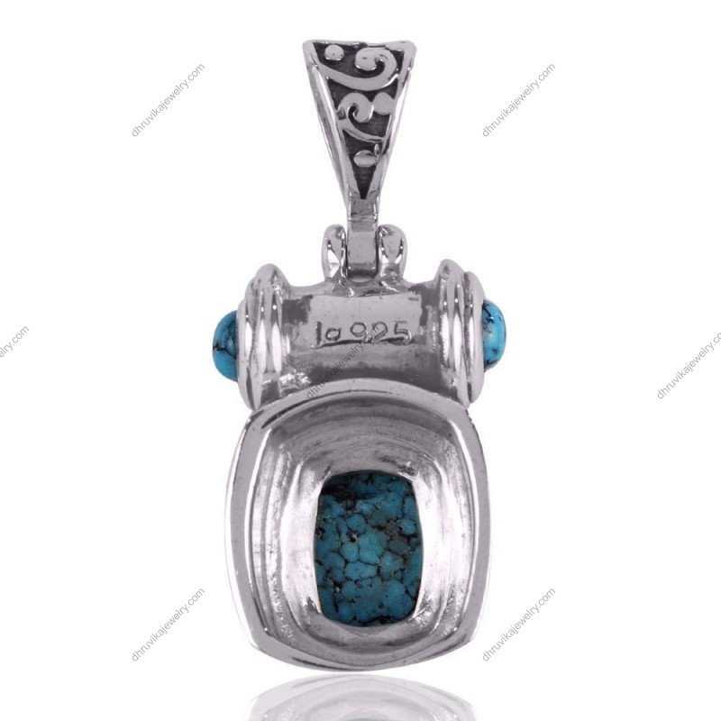 Sterling silver turquoise pendant with intricate detailing and artisan design view1