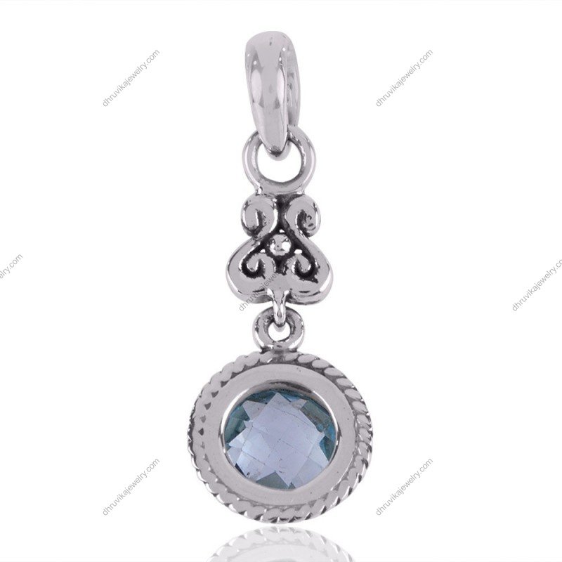 Sterling silver blue topaz pendant with vintage scroll detailing view1