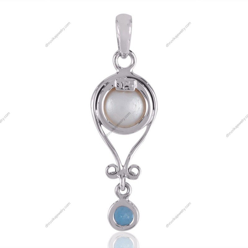 Sterling silver pearl and blue topaz pendant with intricate design for timeless elegance view1