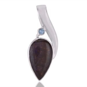 Silver pendant with fossilized gemstone and blue topaz accent in sterling silver setting main view