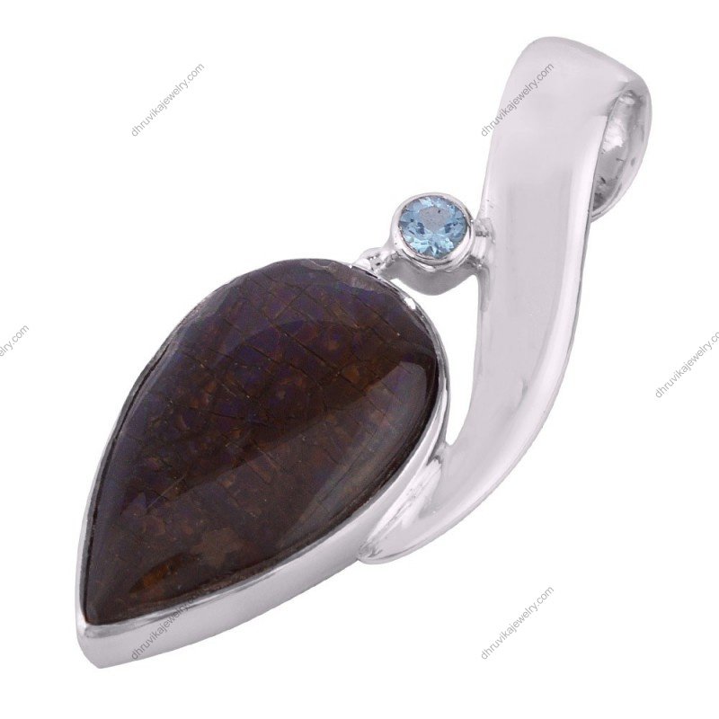 Silver pendant with fossilized gemstone and blue topaz accent in sterling silver setting alternate image