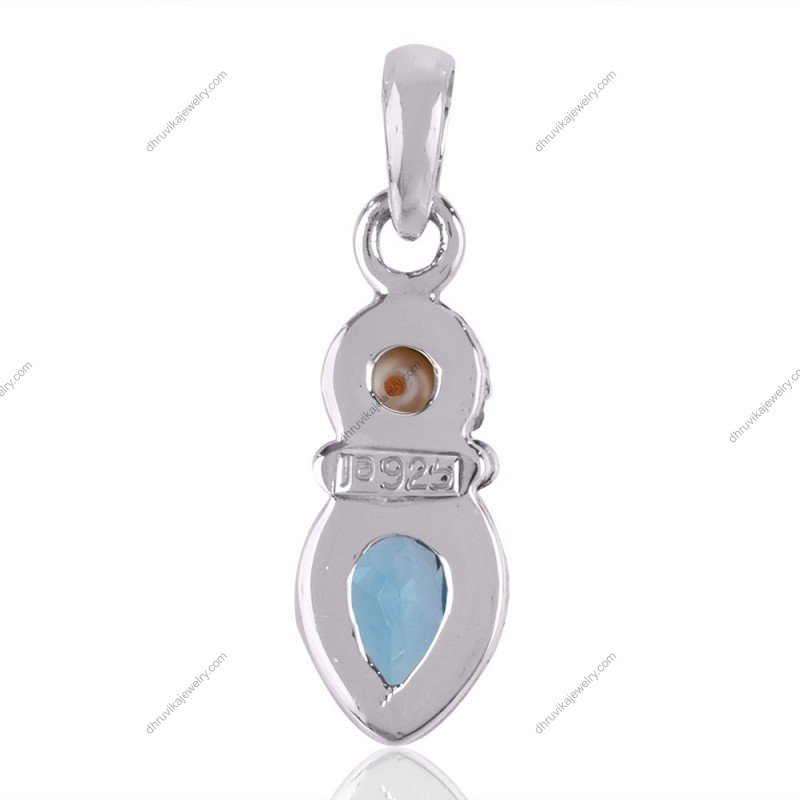 Sterling silver blue topaz and pearl pendant with vintage detailing, perfect for elegant styling and gift giving. view1