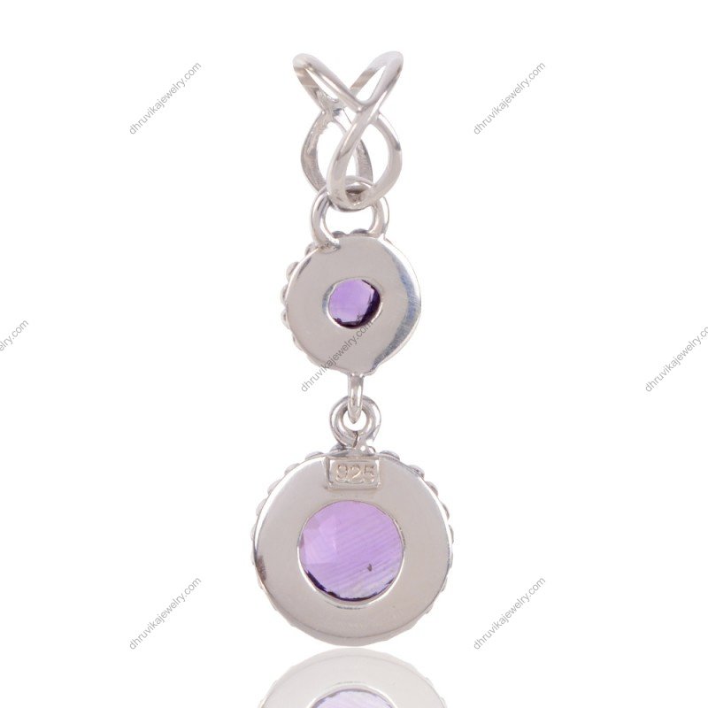 Sterling silver amethyst pendant with two faceted purple gemstones in an elegant design view1