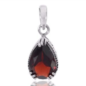 Sterling silver garnet teardrop pendant with faceted red gemstone in elegant setting main view