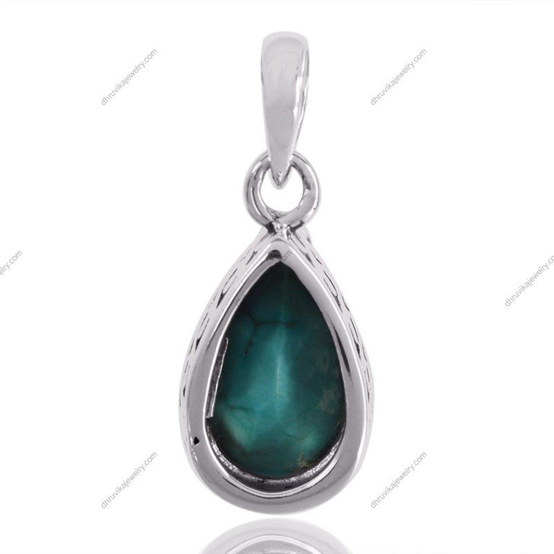Sterling silver turquoise teardrop pendant with intricate silver detailing view1