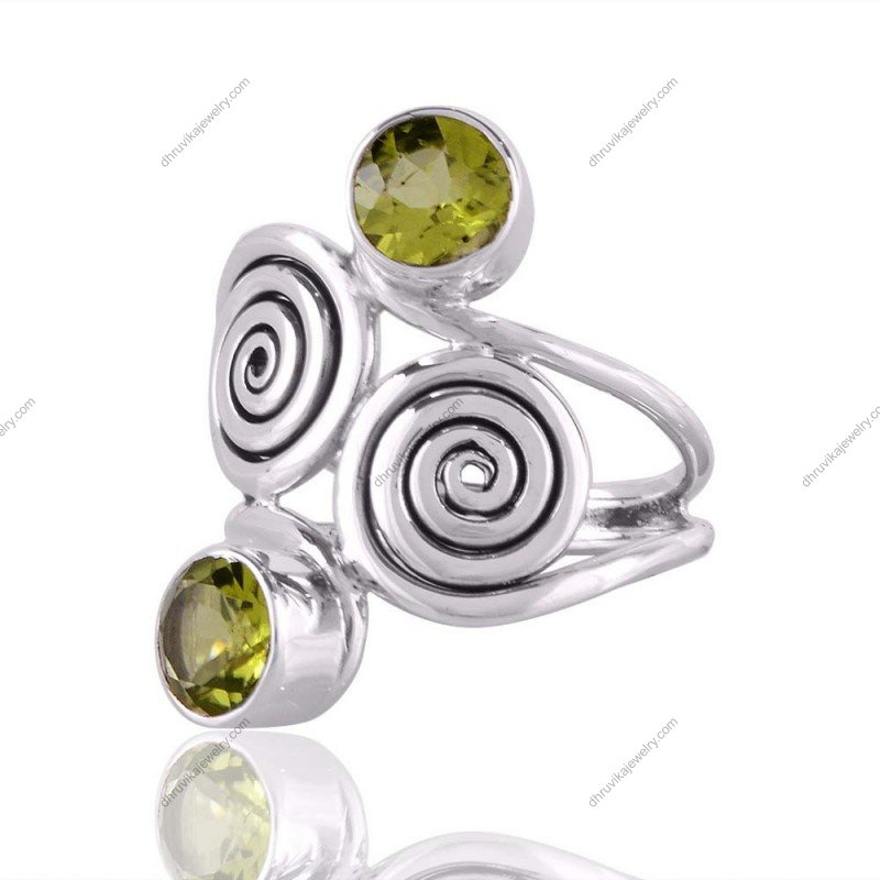 Sterling silver peridot spiral ring featuring two round-cut gemstones in an artistic swirl design alternate image