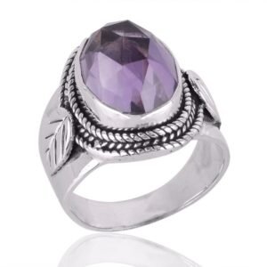 Vintage sterling silver amethyst ring with intricate detailing and faceted purple gemstone main view